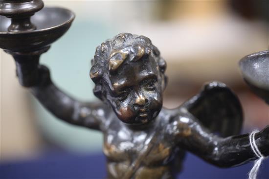 A Renaissance bronze candelabrum modelled as a cherub, height 9.25in.